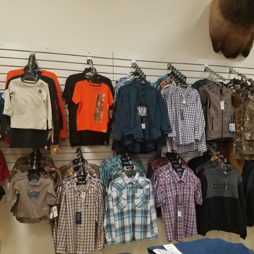 Flannels hung on the racks of a wall